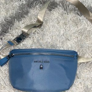 Brand new Michael Kors Fanny pack with tags! Blue with a beige strap